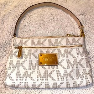 Michael Kors cream and tan wristlet, gold hardware, like new.